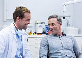patient and dentist discussing dental implants in Irving