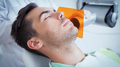 Relaxing patient receiving dental care