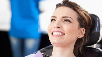 Smiling, relaxed woman in the dental chair