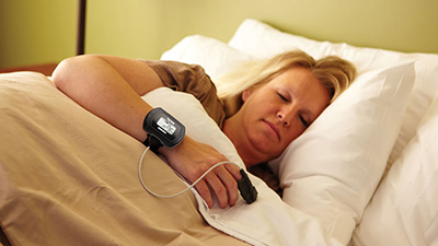 Woman completing at-home sleep test