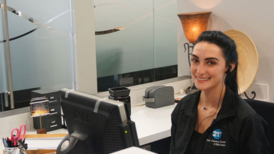 Smiling woman at front desk