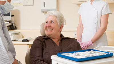 Smiling older woman in dental chair