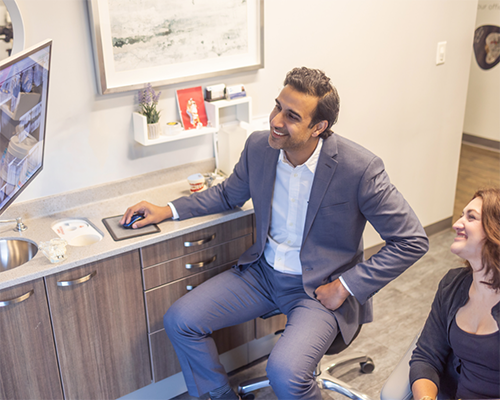 Doctor Kumar showing a monitor to a patient