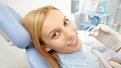 Woman receiving dental exam