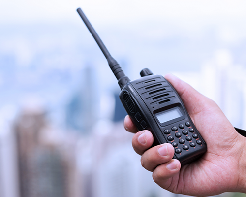Hand holding a walkie-talkie