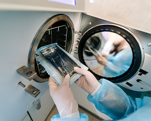 Placing dental instruments in an autoclave