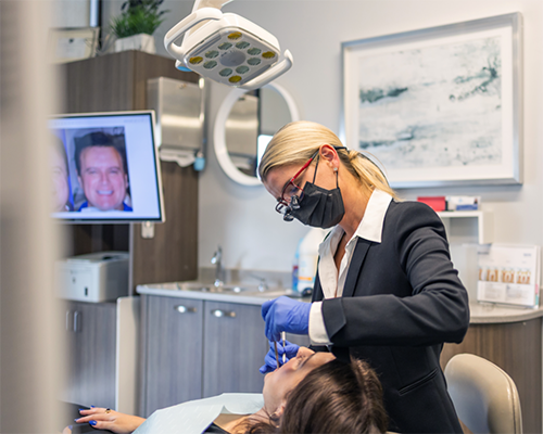 Doctor Bristow performing a dental exam