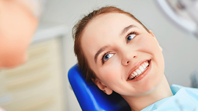 Smiling woman in dental chair