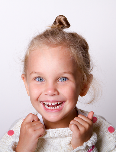 Young girl grinning
