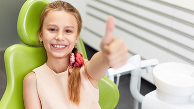 Little girl giving thumbs up