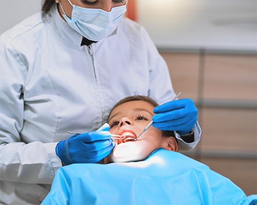 Boy getting a dental exam