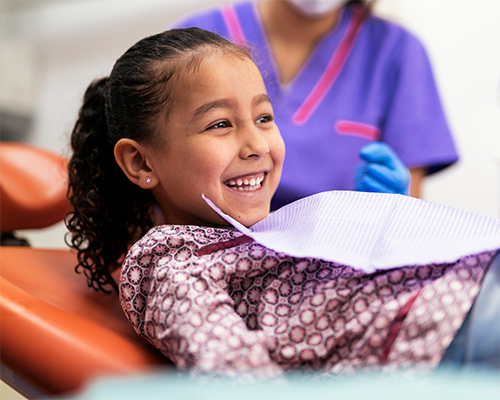 Young girl laughing in the dental chair