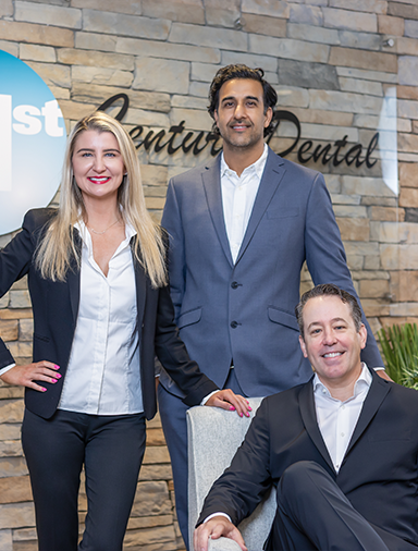 The three smiling dentists at 21st Century Dental of Irving