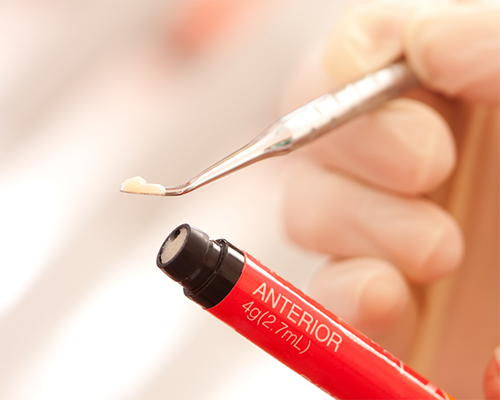 Dentist preparing to place a filling