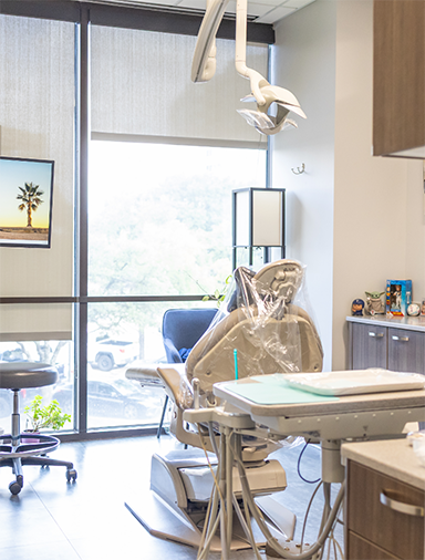 Empty dental chair seen from behind