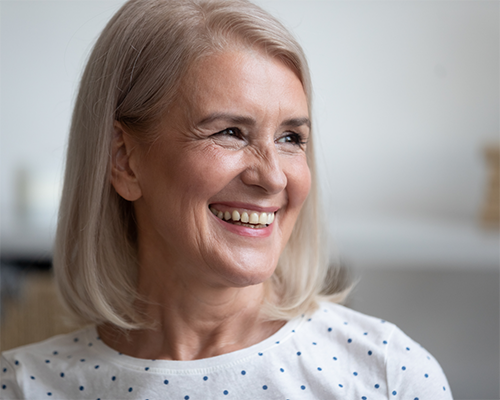 Smiling older woman with a blonde bob