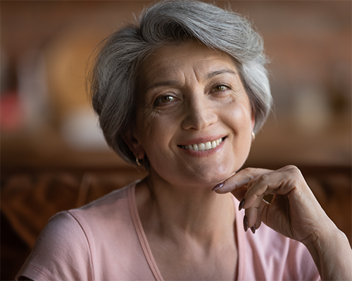 Smiling woman with short gray hair