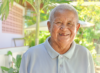 Smiling senior man missing multiuple teeth