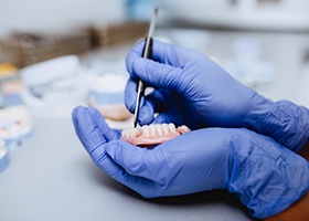 Dental lab technician working on dentures