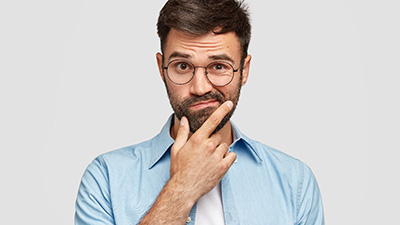 Puzzled man with questions for his emergency dentist in Irving