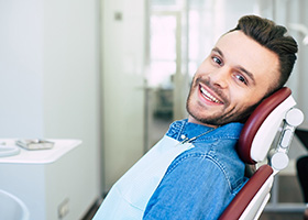 Man smiling after toothache treatment in Las Colinas