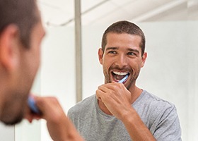 Man brushing teeth in Irving