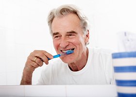 Man brushing teeth in Irving