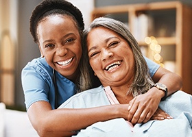 Woman smiles with dental implants in Irving