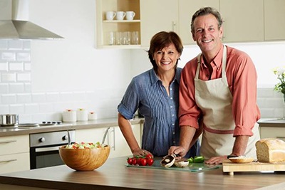Older couple preparing food