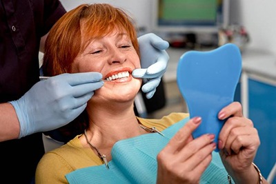 Older woman smiling at her dental appointment