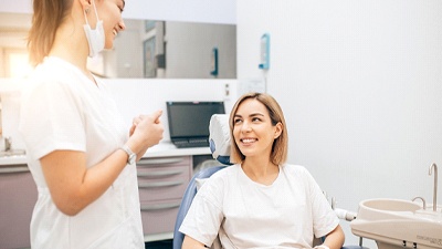 patient talking to dentist about cost of Invisalign in Irving