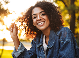 Young woman in a denim jacket outdoors