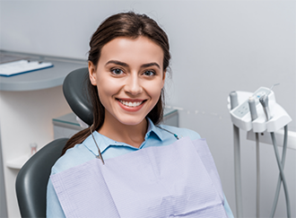 Young brunette woman at the dentist
