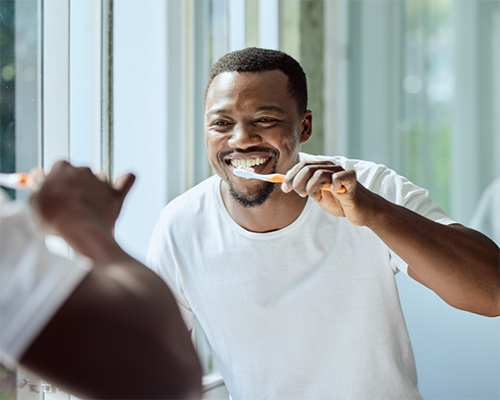 Man flossing his teeth