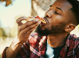 Man eating pizza
