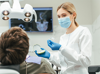 Dentist showing Invisalign to a patient