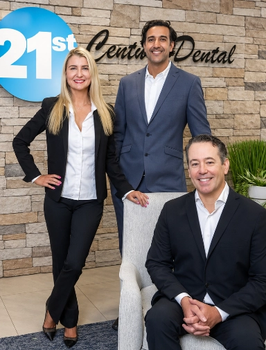 Three smiling dentists at 21st Century Dental of Irving