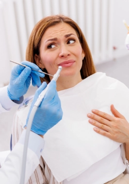 Woman looking skeptically at her dentist