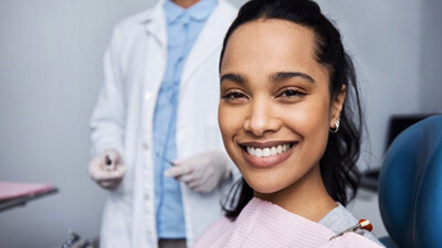 a patient smilinf after undergoing lase dentistry