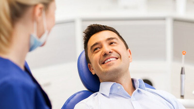 a patient smiling after undergoing dental treatment