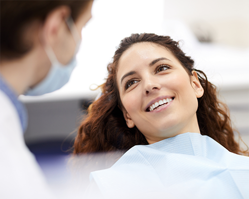 Brunette woman listening to her dentist