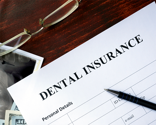 Dental insurance paperwork on a table