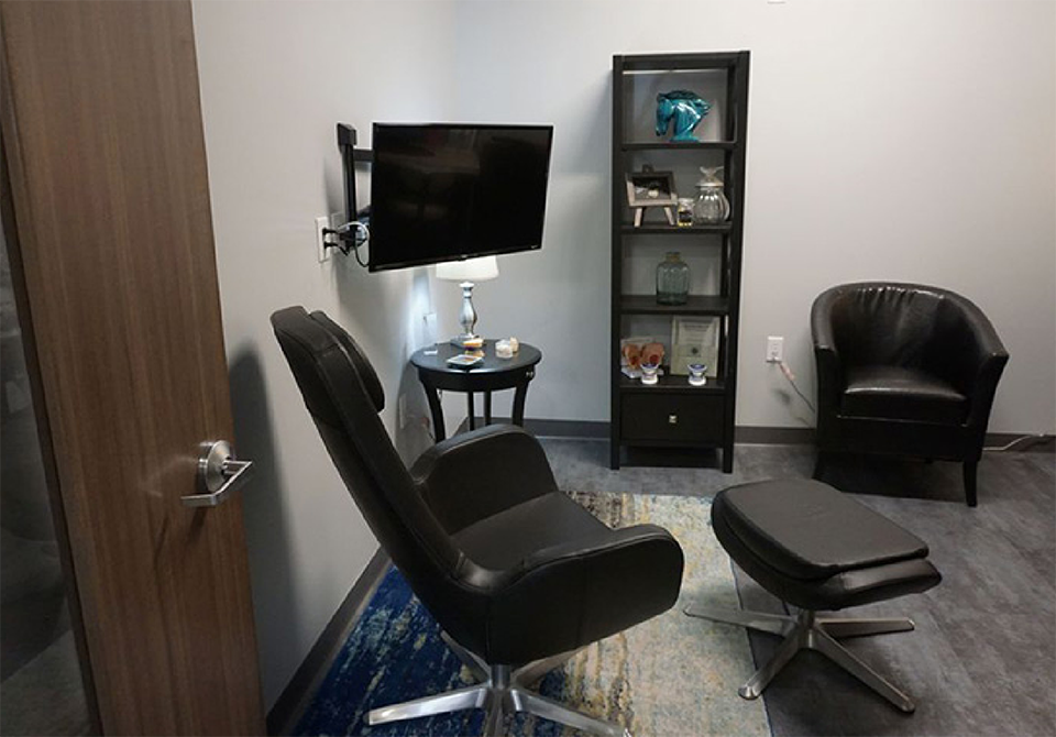 Two black chairs in a consultation room
