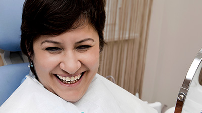 Smiling woman in dental chair