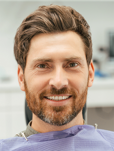 Man with a brown beard at the dentist