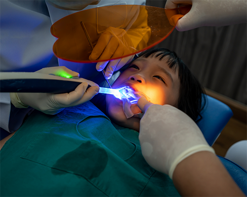 Child getting a dental procedure