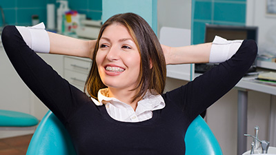 Relaxing woman with hands behind head