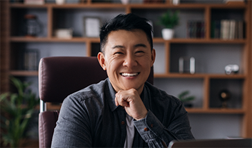 Man in business attire sitting at a desk