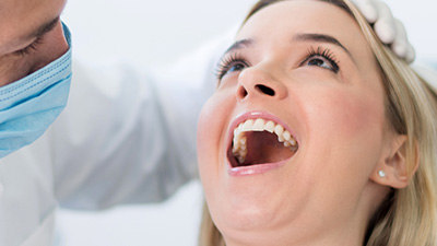 Woman receiving dental exam