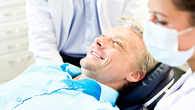 Smiling man in dental chair